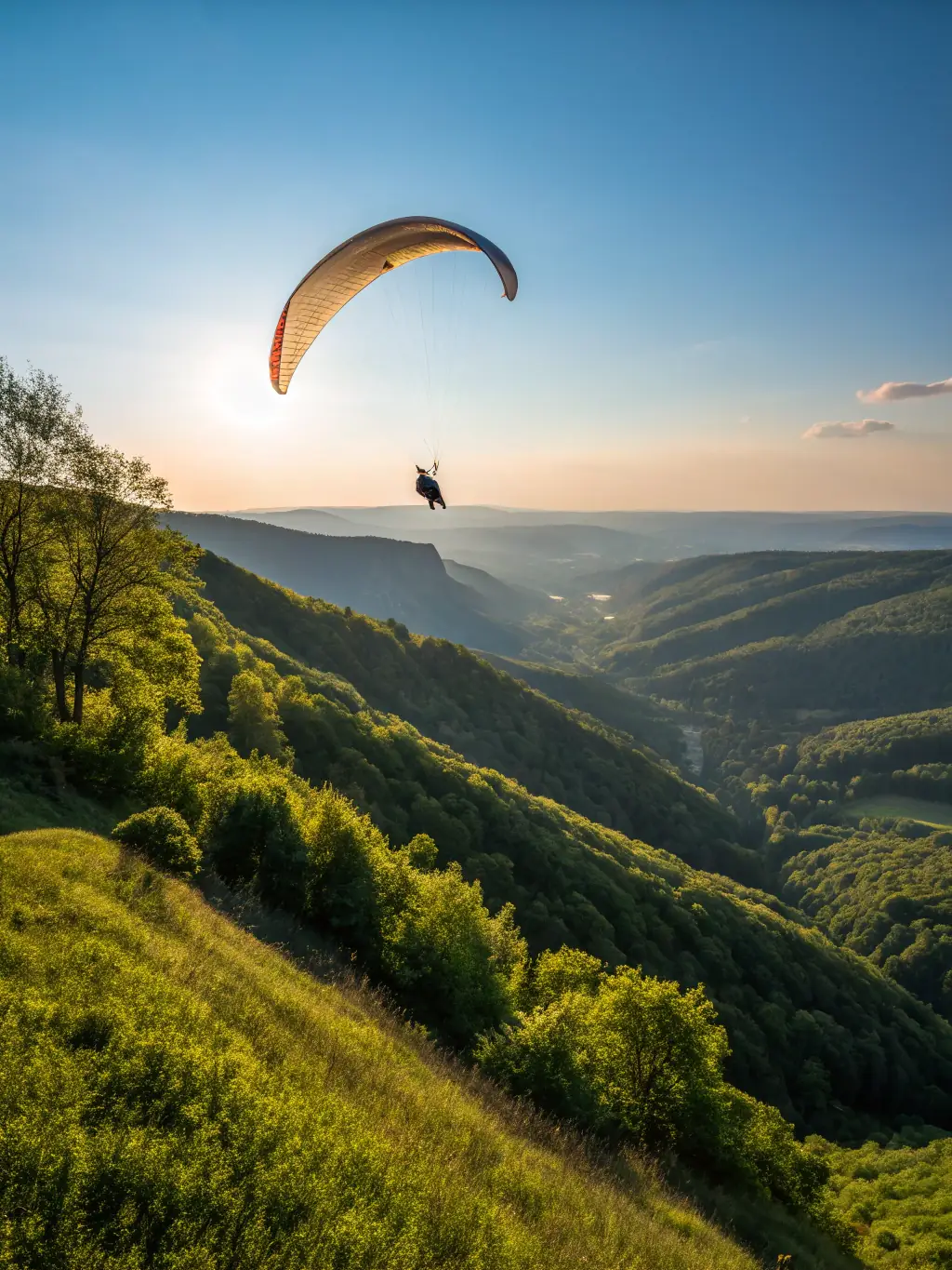 A vibrant photograph capturing the excitement of a paragliding competition in Treignac, France, with colorful gliders soaring against a backdrop of lush green hills and a clear blue sky, showcasing the dynamic nature of the event.